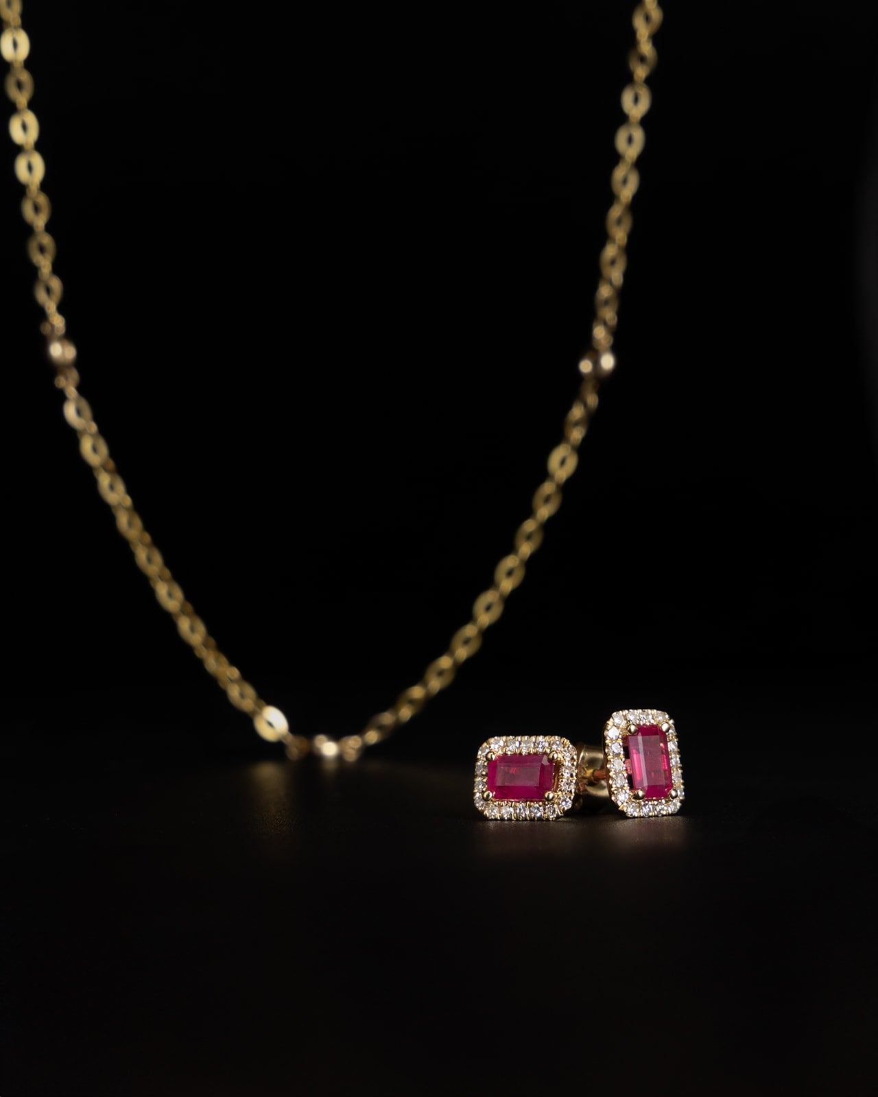 Halo Ruby & Diamond Stud Earrings in Yellow Gold