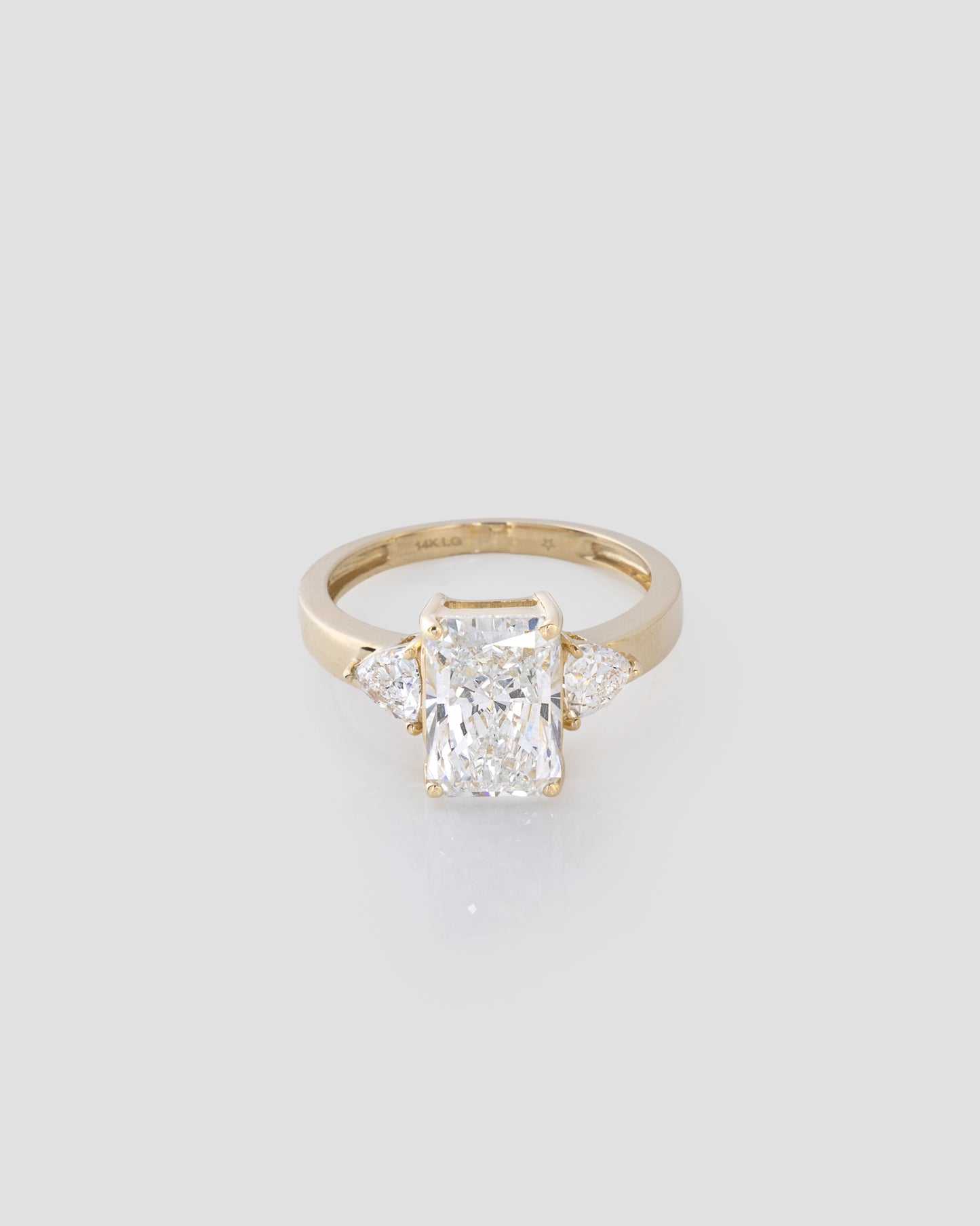 Center Emerald Diamond Ring in Yellow Gold