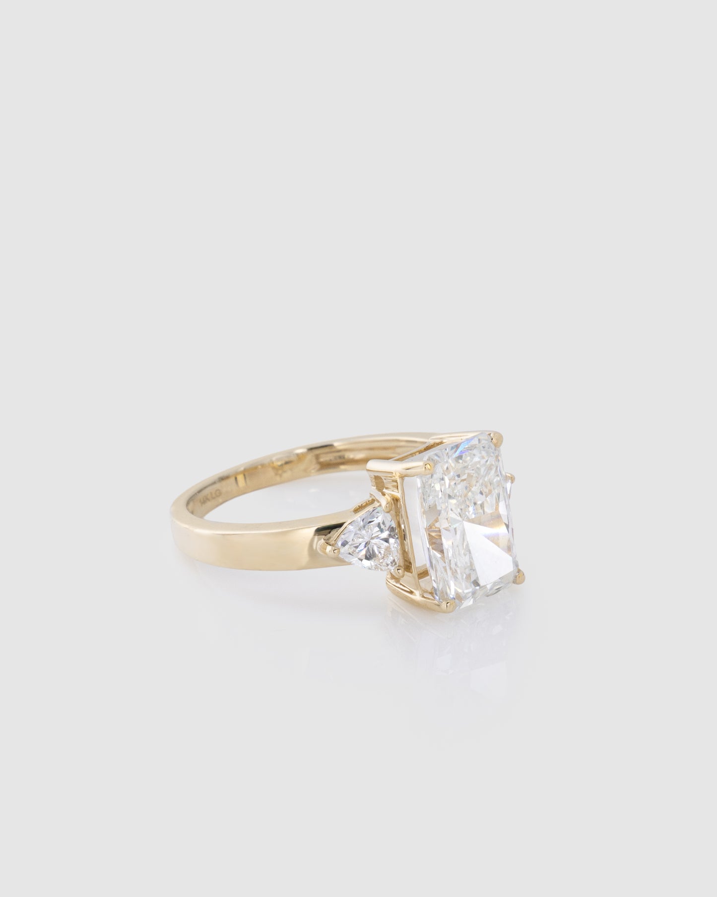 Center Emerald Diamond Ring in Yellow Gold