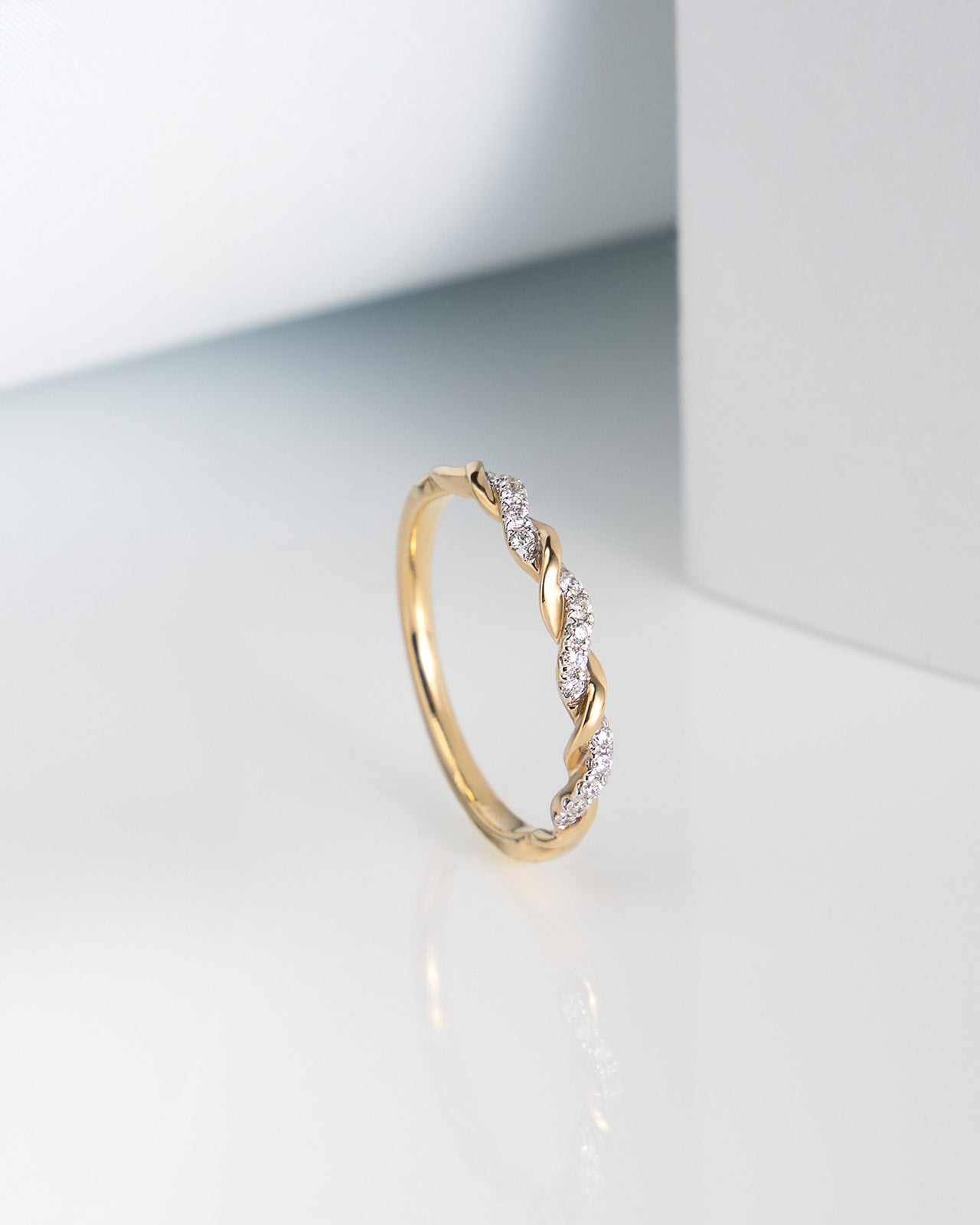 Ten Diamond Twist Band in Yellow and White Gold