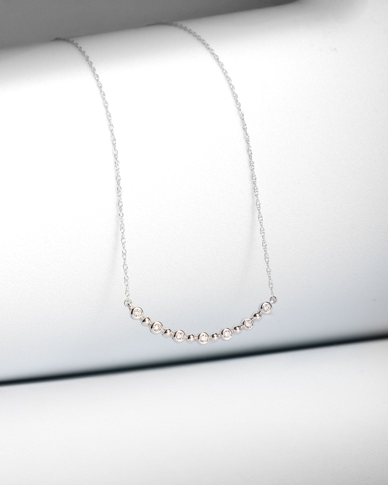 Curved Line Diamond Pendant in White Gold