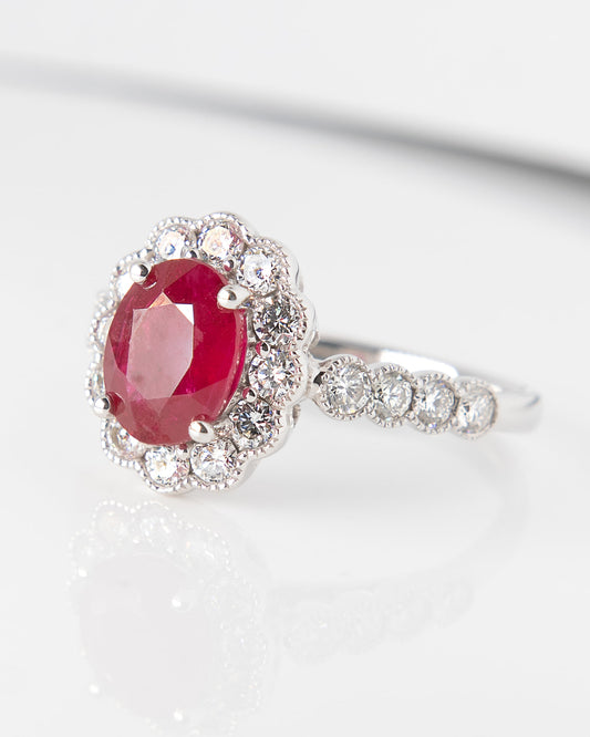 Oval Ruby and Diamond Halo Ring in White Gold