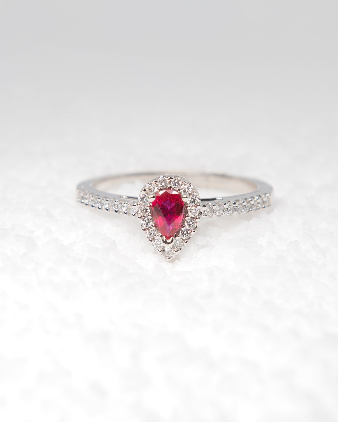 Pear Cut Ruby and Diamond Halo Ring in White Gold