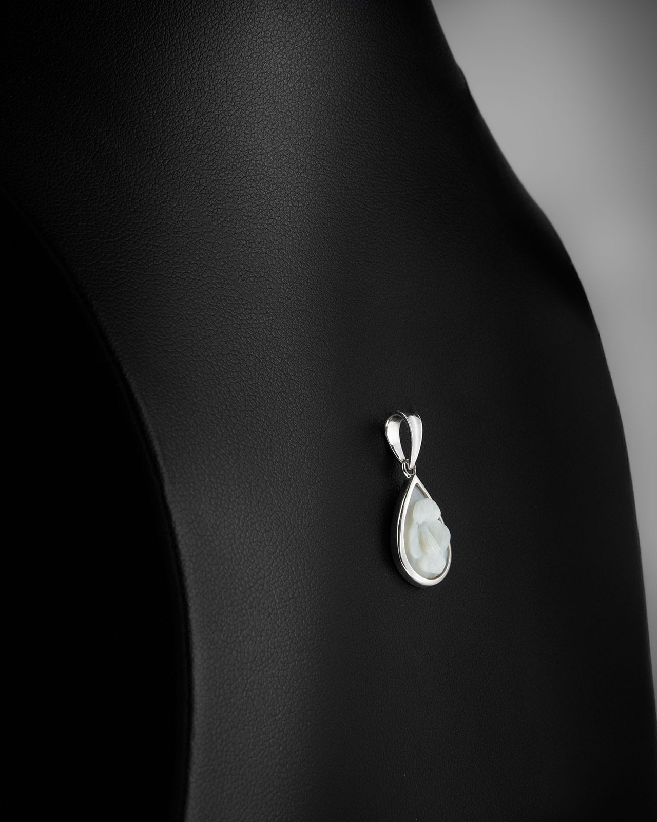 Carved Opal Pendant in White Gold