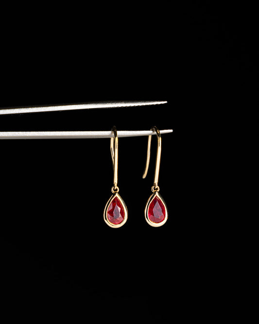 Pear Ruby Bezel Set Dangle Earrings in Yellow Gold