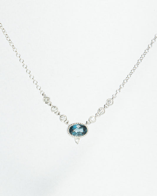 Oval Blue Topaz and Diamond V Pendant in White Gold