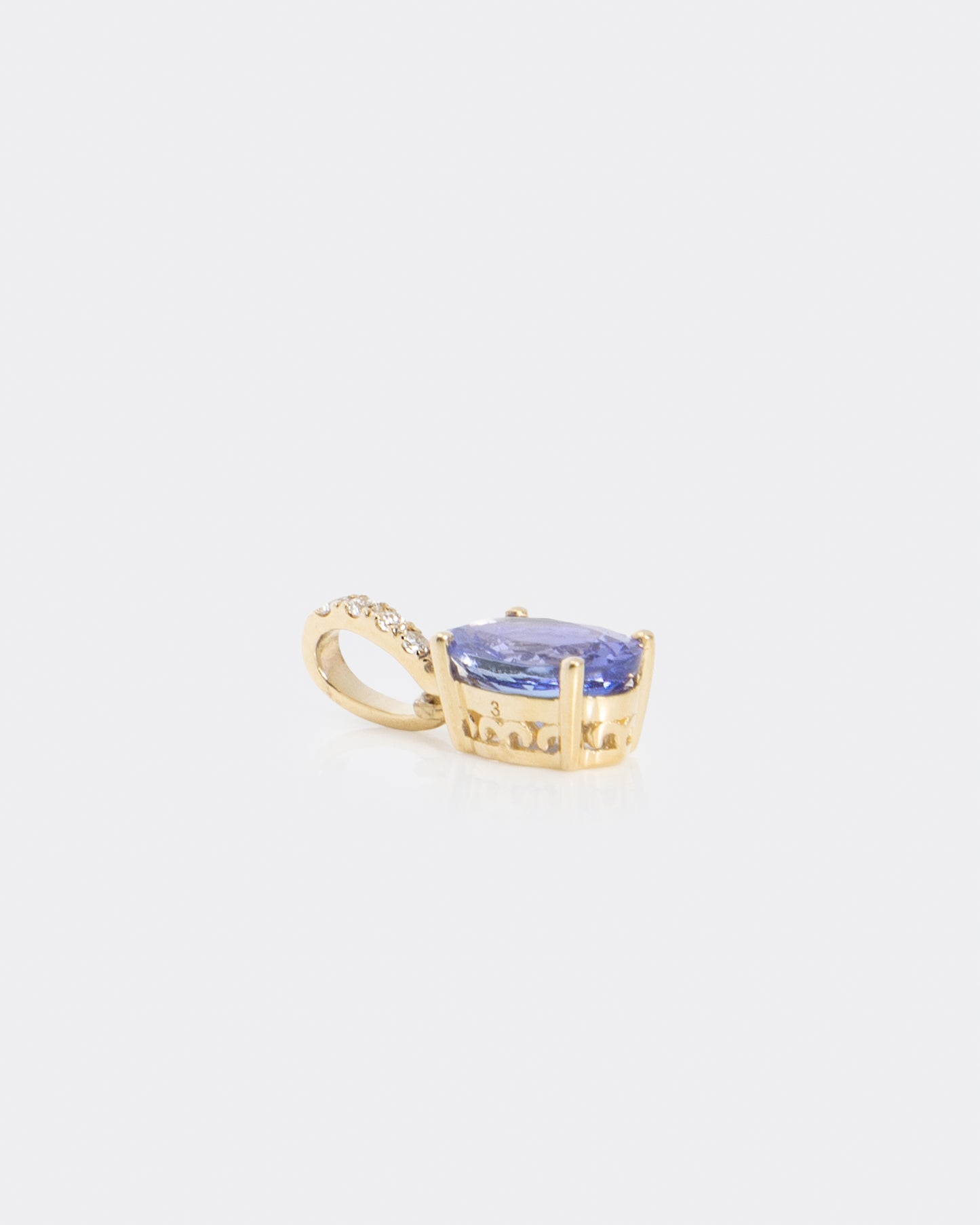 Oval Tanzanite & Diamond Pendant in Yellow Gold