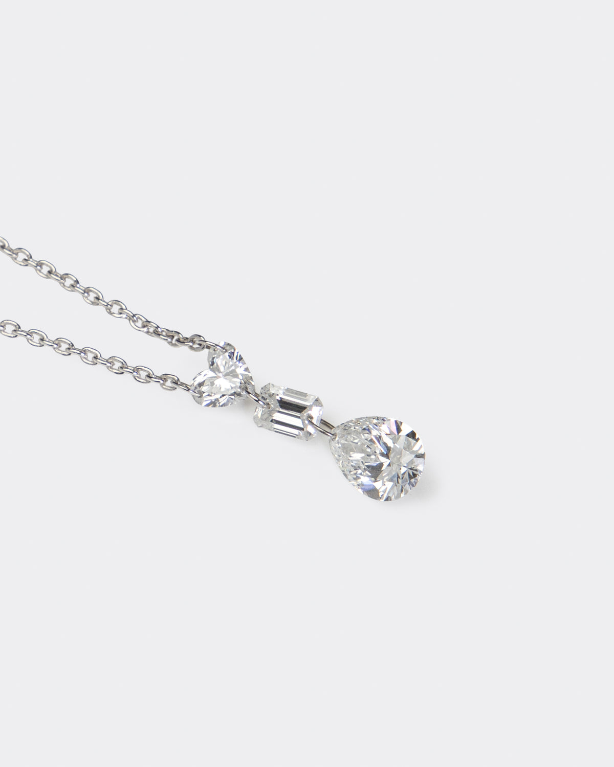 Heart, Emerald, & Pear Diamond Necklace in White Gold