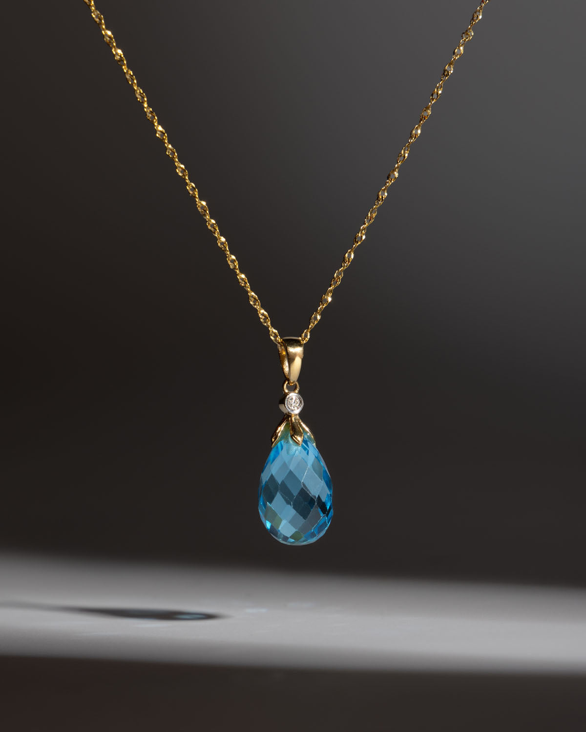 Tear Drop Blue Topaz & Diamond Pendant in Yellow Gold