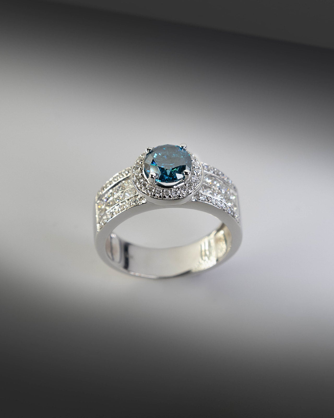 Four Row Blue Diamond Ring in White Gold