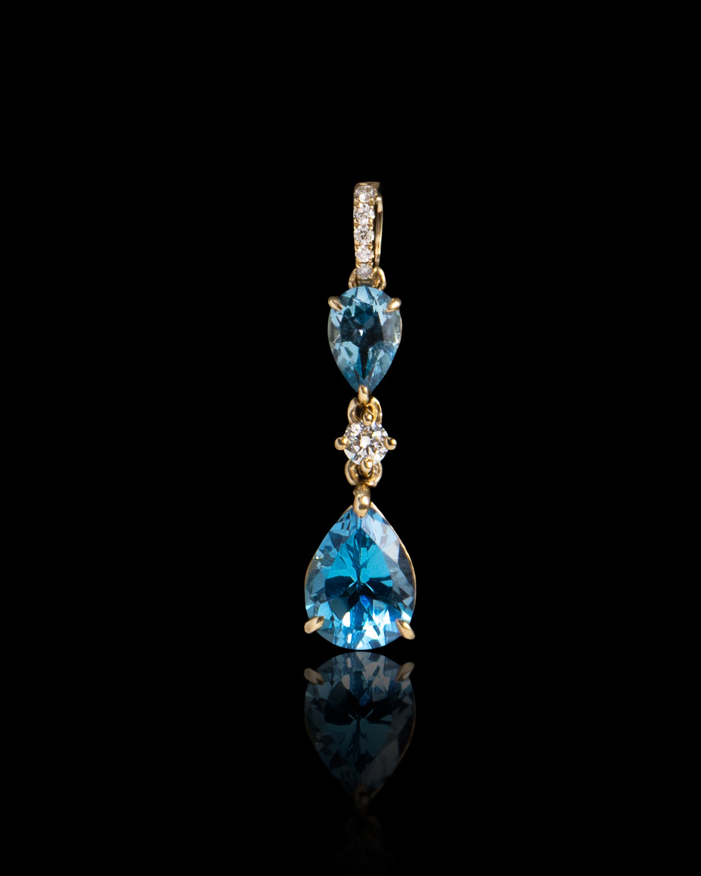 Blue Pear Topaz & Diamonds Pendant in Yellow Gold