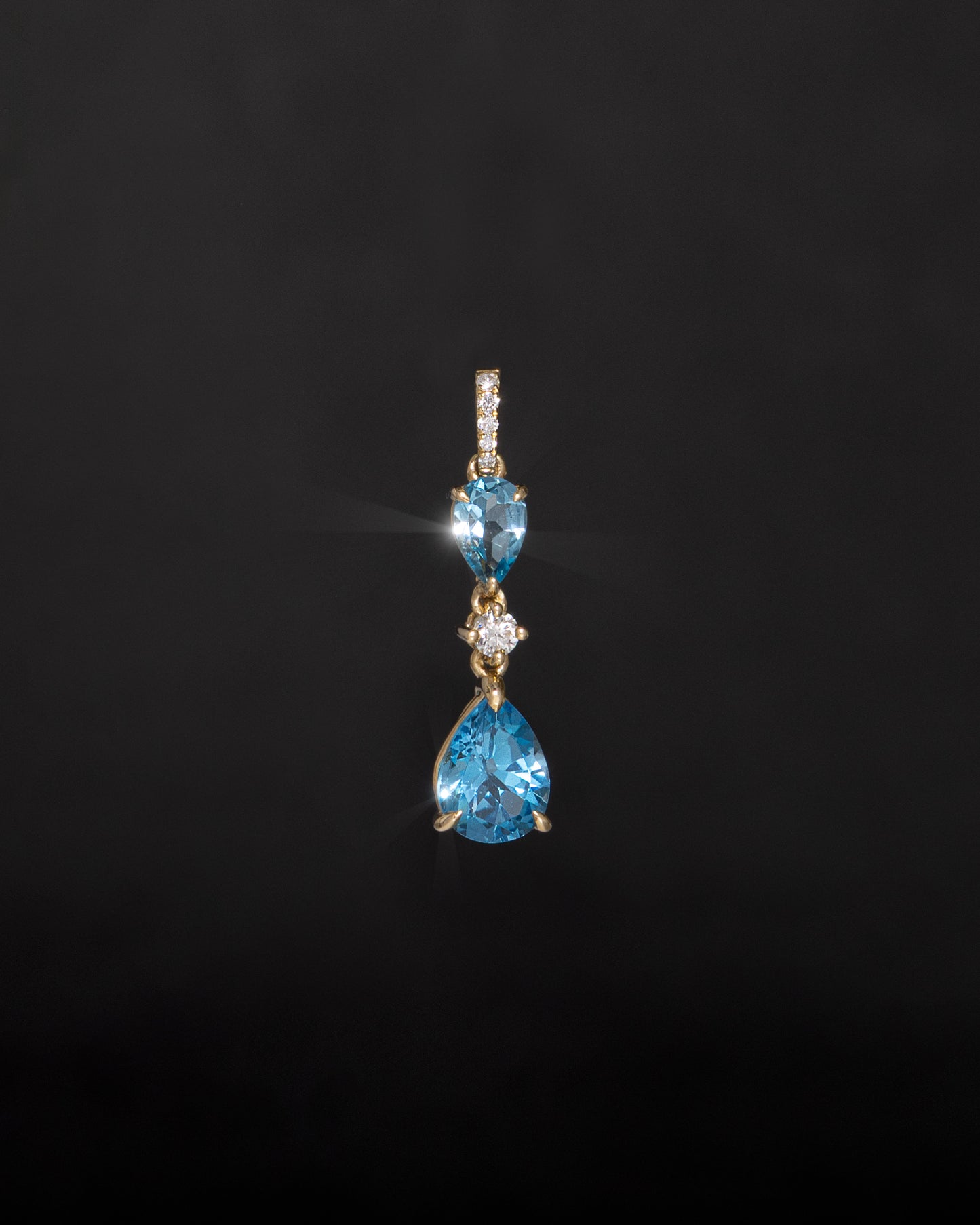 Blue Pear Topaz & Diamonds Pendant in Yellow Gold
