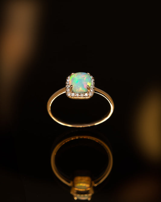 Opal and Diamond Halo Ring in Yellow Gold