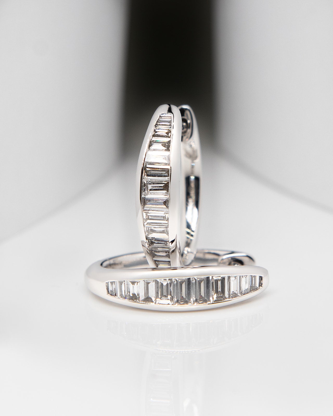 Baguette Diamond Huggie Hoop Earrings in White Gold