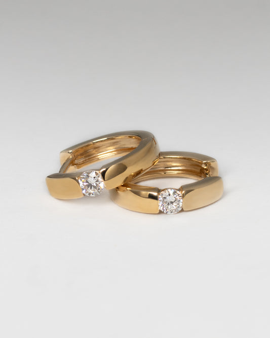 Center Diamond Huggie Earrings in Yellow Gold